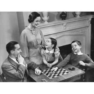  Family With Two Children (8 9) Playing Checkers 