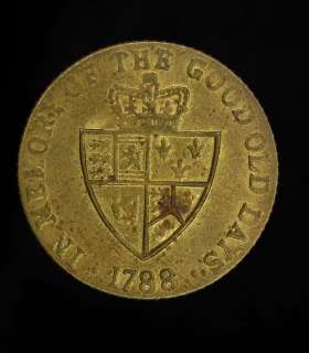 An interesting, antique brass English Spade Guinea gaming token, of 