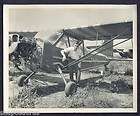 Man w his old AIRPLANE Engine exposed n plane parking lot Vintage 