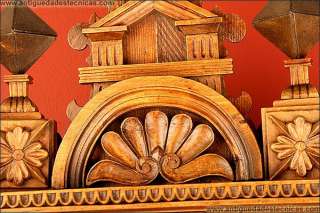 Hand carved wall clock in cypress wood. 19th century  