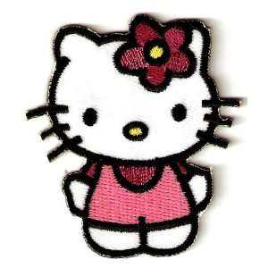 Hello Kitty w pink flower as bow & maroon shirt in pink overalls 