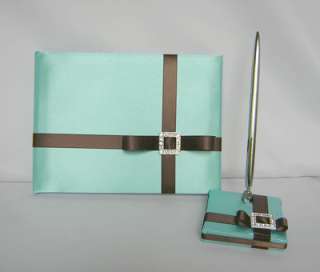 IS COVERED WITH TIFFANY BLUE SATIN FABRIC AND DECORATED WITH CHOCOLATE 