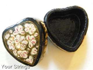 This is a beautiful hand painted heart shaped lacquer box with a 