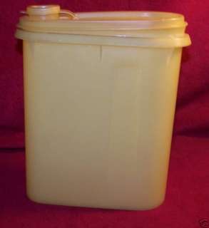 Tupperware yellow triangular storage container 7in tall  